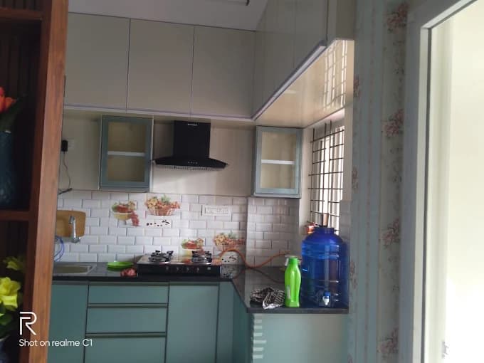 Kitchen cabinetry with tiled backsplash